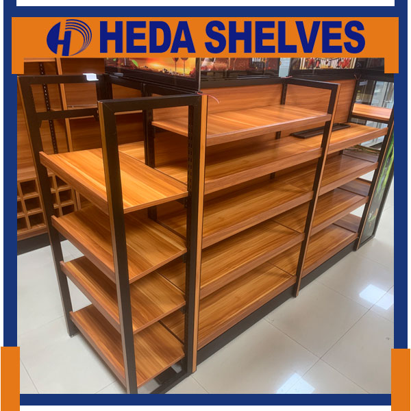 Genuine HEDA WGRFLS01 side perspective showing a long connected wood-grain gondola shelf with black steel posts, horizontal wooden levels and rectangular metal end frames