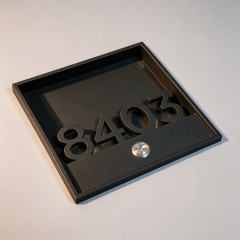 Black Framed Hotel Room Number Sign
