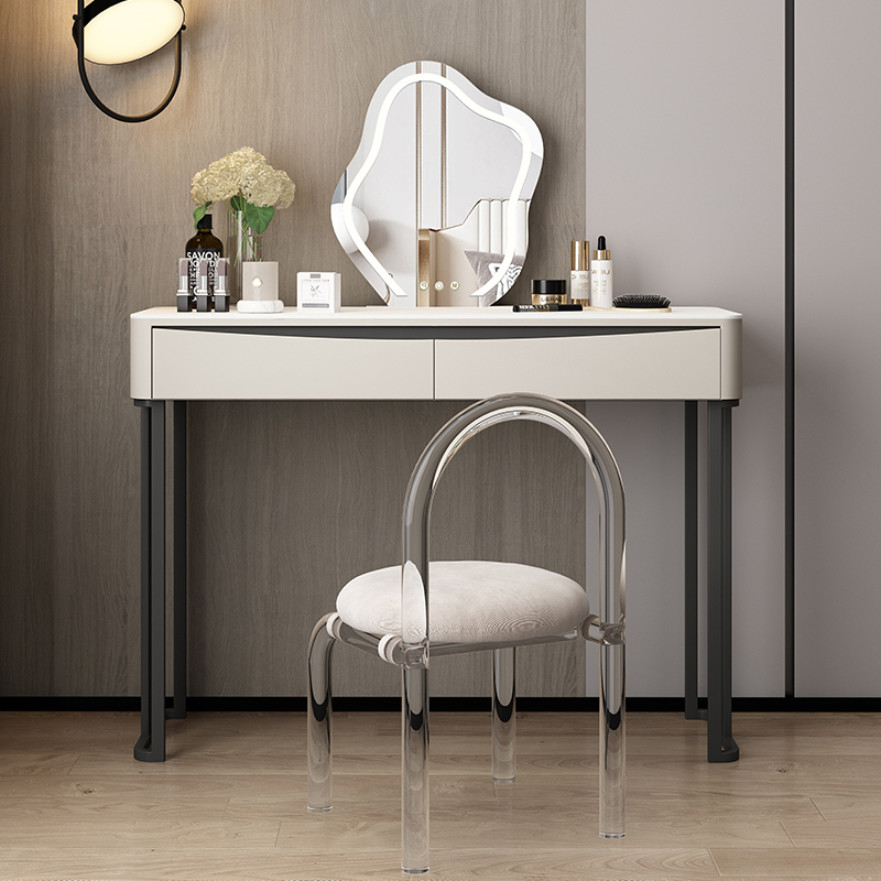 The image shows a modern vanity with a chair in front of it, featuring a mirror and storage drawers.