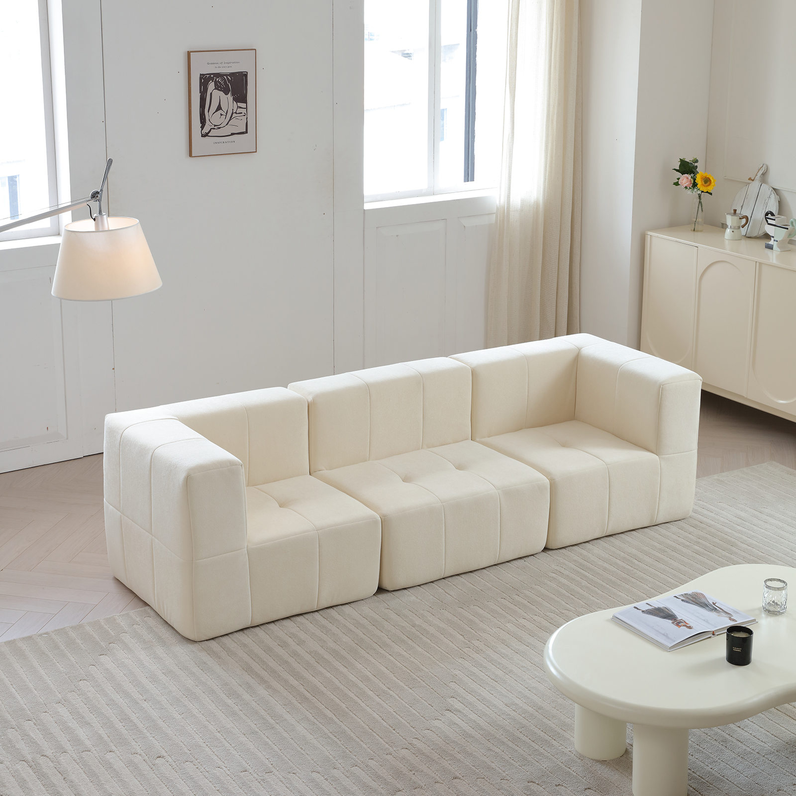Large white sectional sofa arranged in a modern interior setting