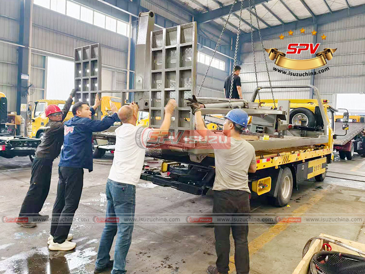 Road Wrecker Superstructure Loaded onto Flatbed Truck in Factory