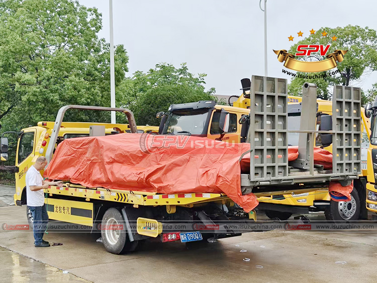 Tow Truck Body Loaded onto Carrying Truck