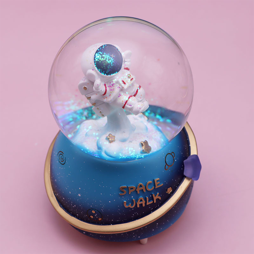 1 pieza de nueva caja de música de astronauta, que incluye batería, reproducción aleatoria de 7 canciones, copos de nieve manuales