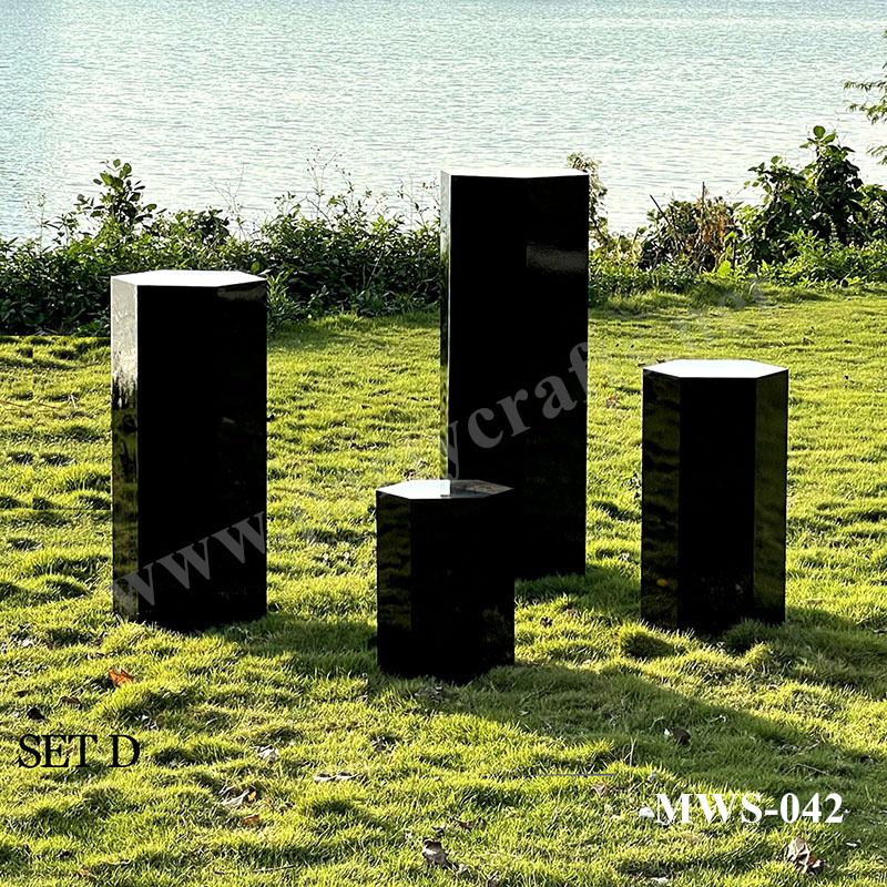 white and black pedestal polygon stand
