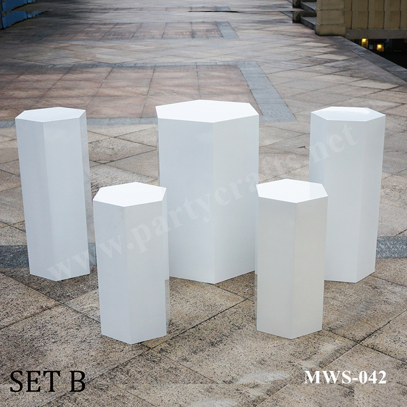 white and black pedestal polygon stand