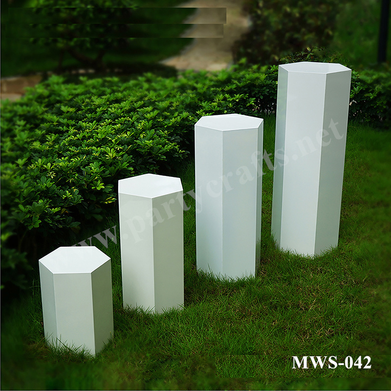 white and black pedestal polygon stand