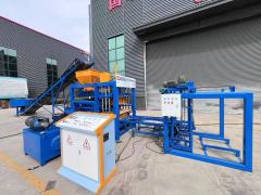 QT4-18 Concrete Block Production Line in Action - 15-second cycle time, PLC-controlled hydraulic system, producing 400×200×200mm hollow blocks from recycled coal ash and cement mixture.