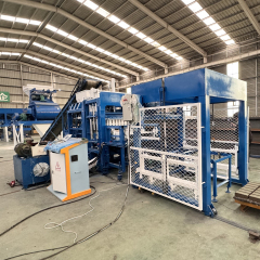 QT10-15 Concrete Block Manufacturing in Action - 15-second cycle time using Siemens control system to create eco-friendly blocks from coal fly ash and cement mix. Features hydraulic press for consistent 16MPa density."