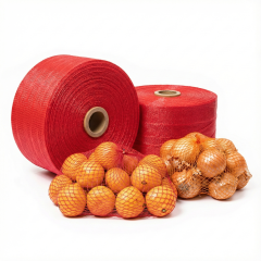 A close-up of a red fruit sleeve net roll, showing the fine HDPE mesh structure.