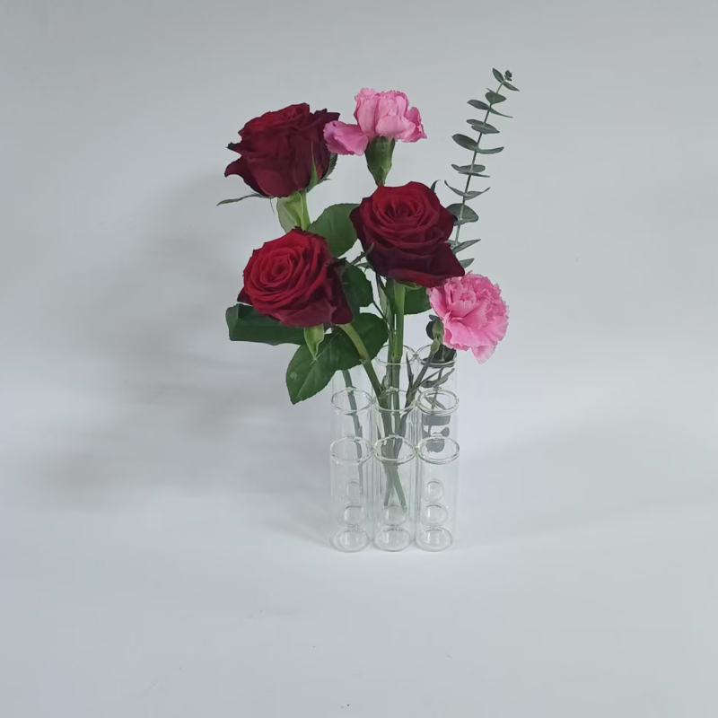 A set of 9 stepped connected tube vases