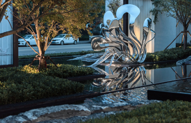 Elegant Polished Stainless Steel Abstract Waterscape Sculpture