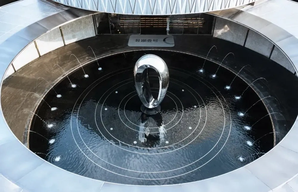 Modern Polished Stainless Steel Rotating Waterscape Art Sculpture