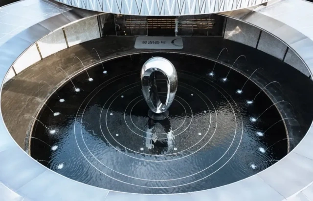 Modern Polished Stainless Steel Rotating Waterscape Art Sculpture