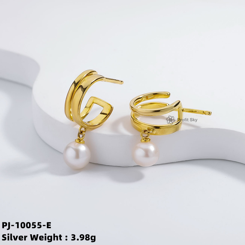Artisan Crafted Beauty: Unique Silver and Pearl Dangle Earrings