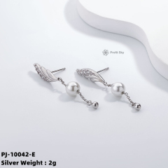 Artisan Crafted Beauty: Unique Silver and Pearl Dangle Earrings