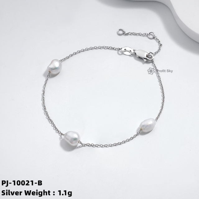 Elegance Defined: Silver Pearl Charm Bracelet