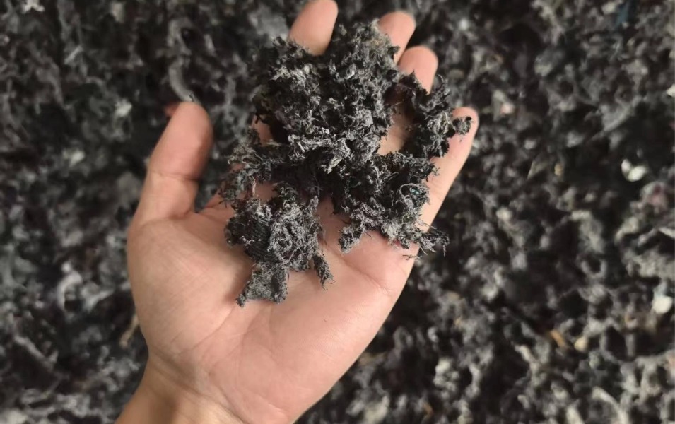 Shredded textile and fabric waste output from SOYU industrial scrap crusher
