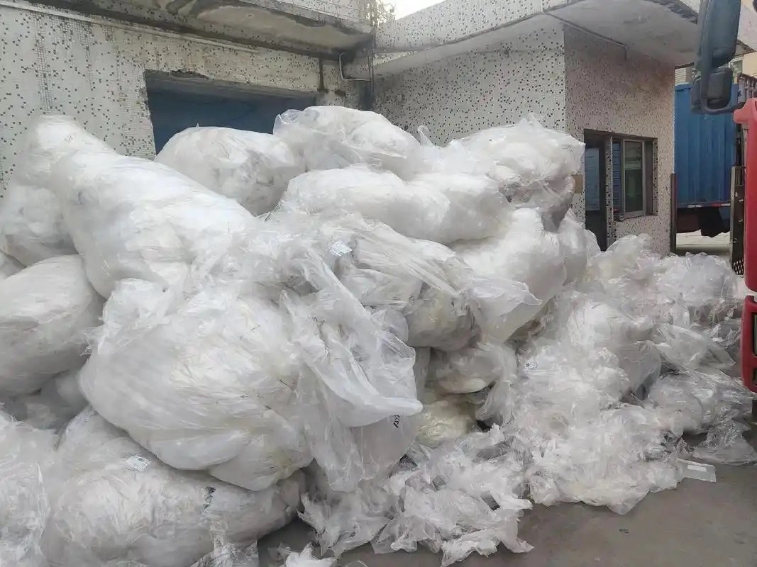 Baled loose raw waste PE/PP plastic films ready for industrial film shredder processing