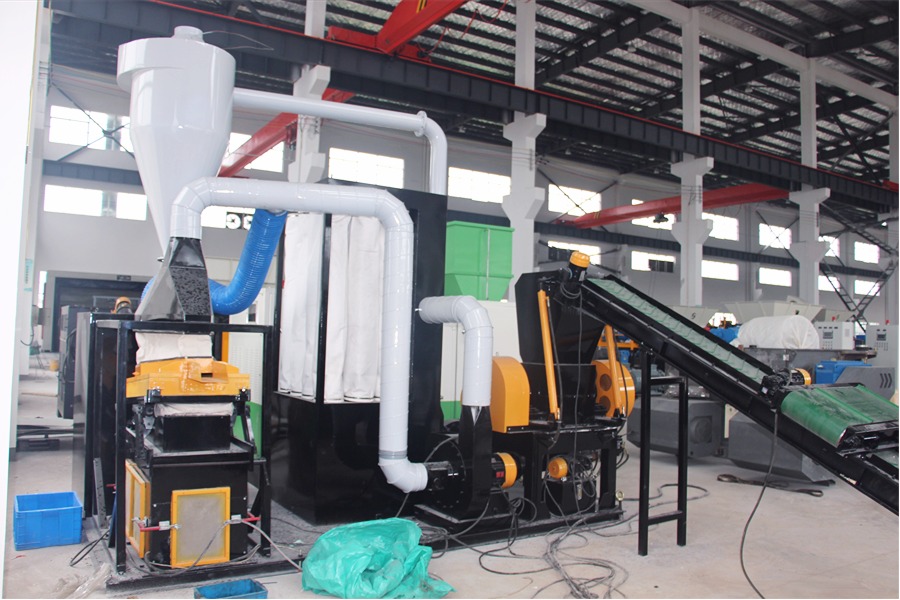 SOYU Compact copper wire recycling and granulating machine with dust collector and conveyor system.