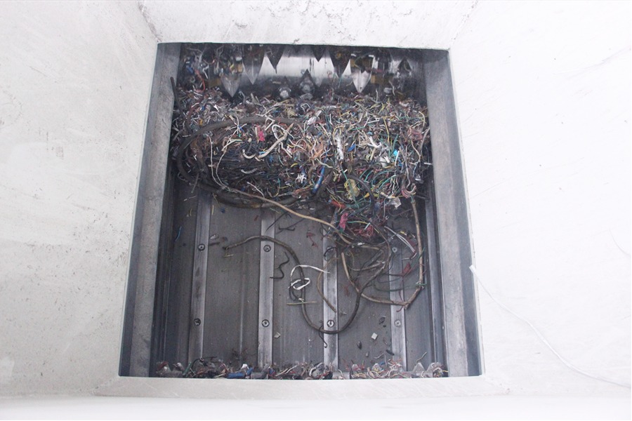soyu Scrap cables and household wires being fed into the heavy duty crusher shredder chamber.