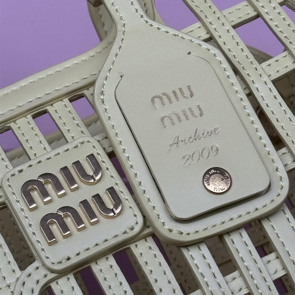 高仿miumiu*5BA294小牛皮鏤空手提包黃色免檢版