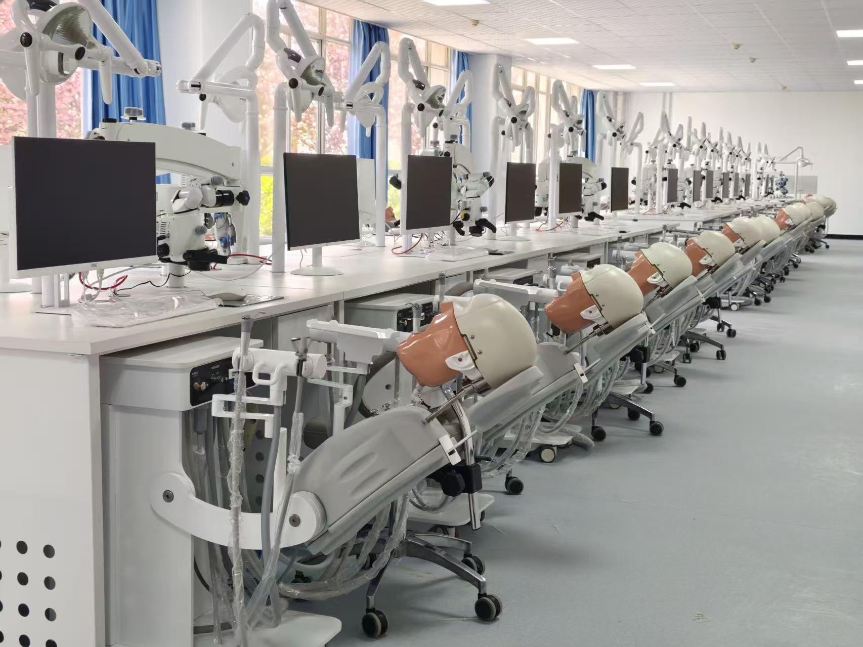 dental school preclinical lab setup with dental simulators and training equipment