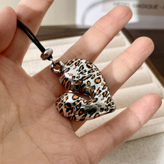 B Hollowed-out Heart Leopard Print Pendant