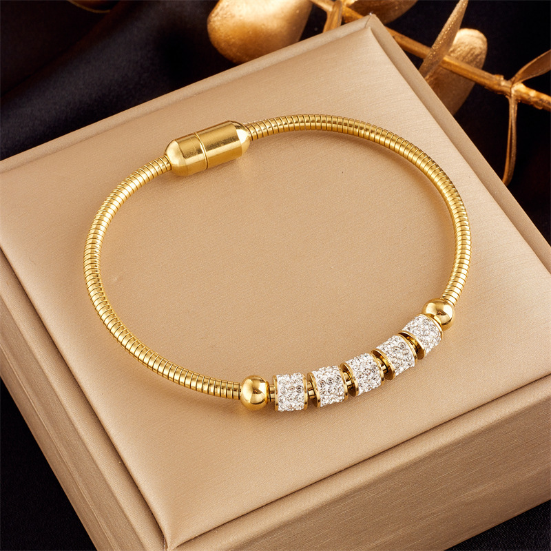 Stylish, sophisticated, niche design, understated luxury, versatile gold-plated butterfly, pearl, flower, and diamond-encrusted bracelet.