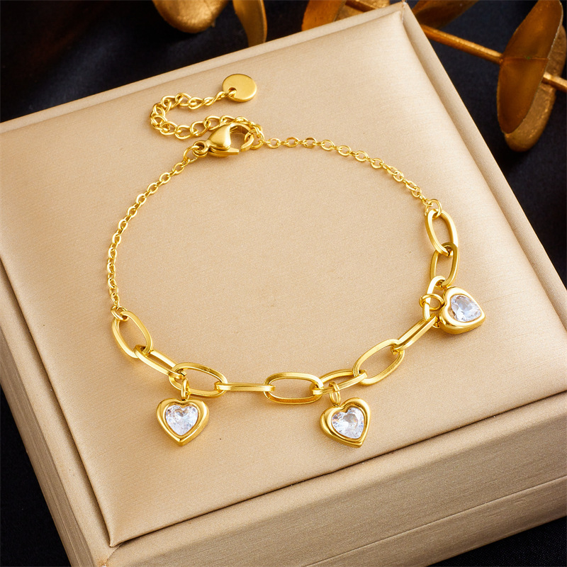 European and American niche retro gold-plated versatile fashion colored gemstone heart pendant titanium steel chain bracelet
