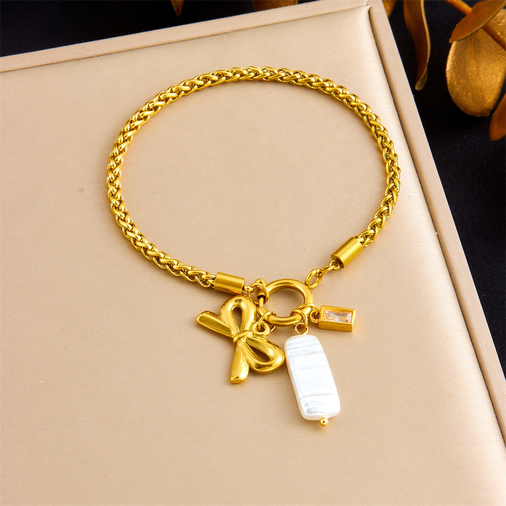 Korean style, fashionable and elegant, simple gold-plated braided chain with bow and seashell pendant, stainless steel gold-plated bracelet.