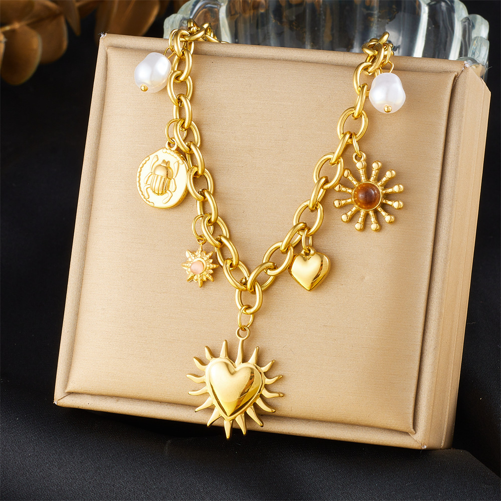 European and American cross-border fashion retro gold-plated chunky chain sun heart pearl insect round pendant stainless steel necklace