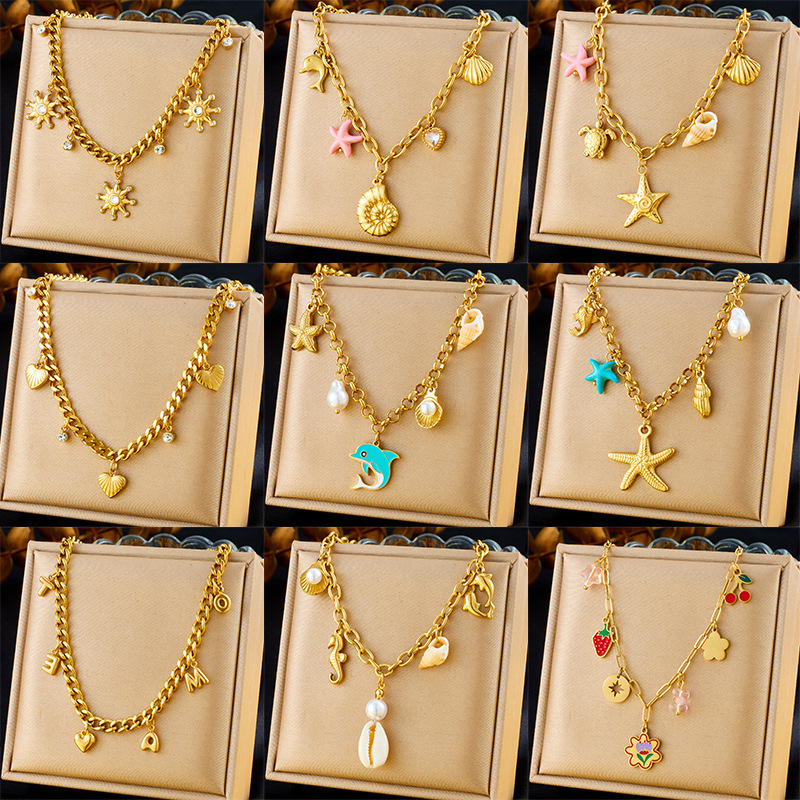 Fashionable and unique resort-style ocean-themed necklace with dripping dolphin, pearl, seashell, and starfish design, featuring a chunky stainless steel chain.