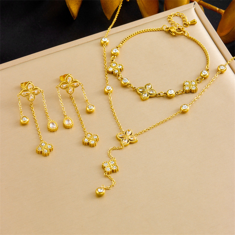 European and American cross-border fashion high-end diamond-encrusted four-petal flower tassel chain pendant stainless steel bracelet earring necklace set
