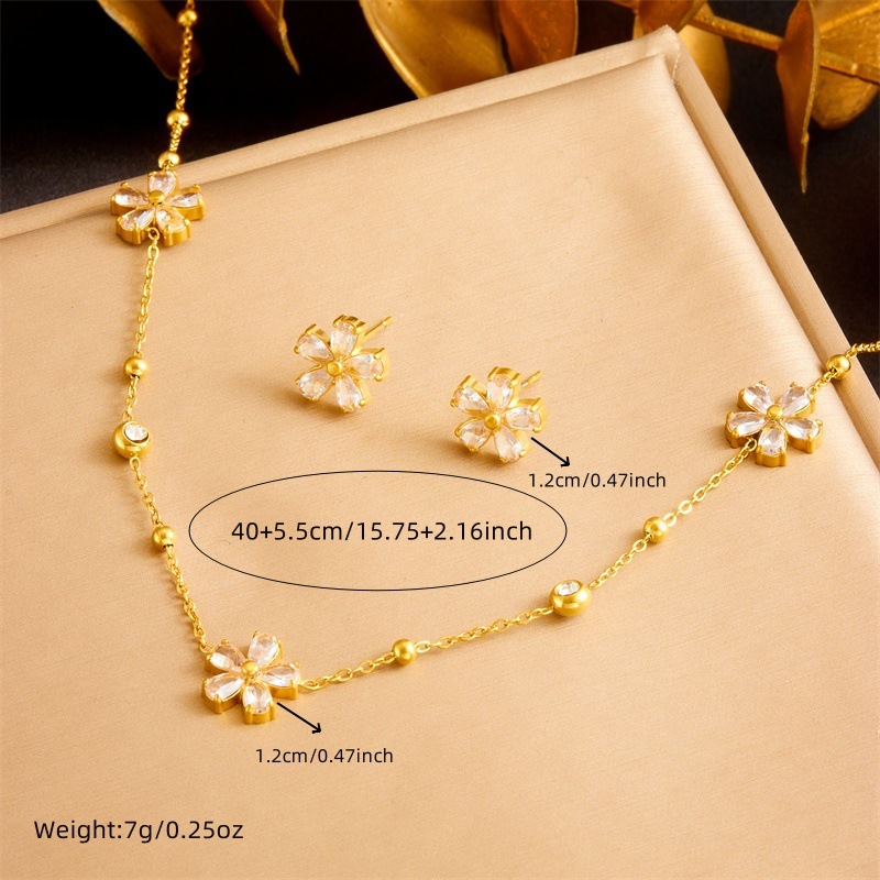 Stylish and simple yet elegant stainless steel jewelry set with transparent rhinestone flower accessories: necklace, earrings, and bracelet (three pieces)