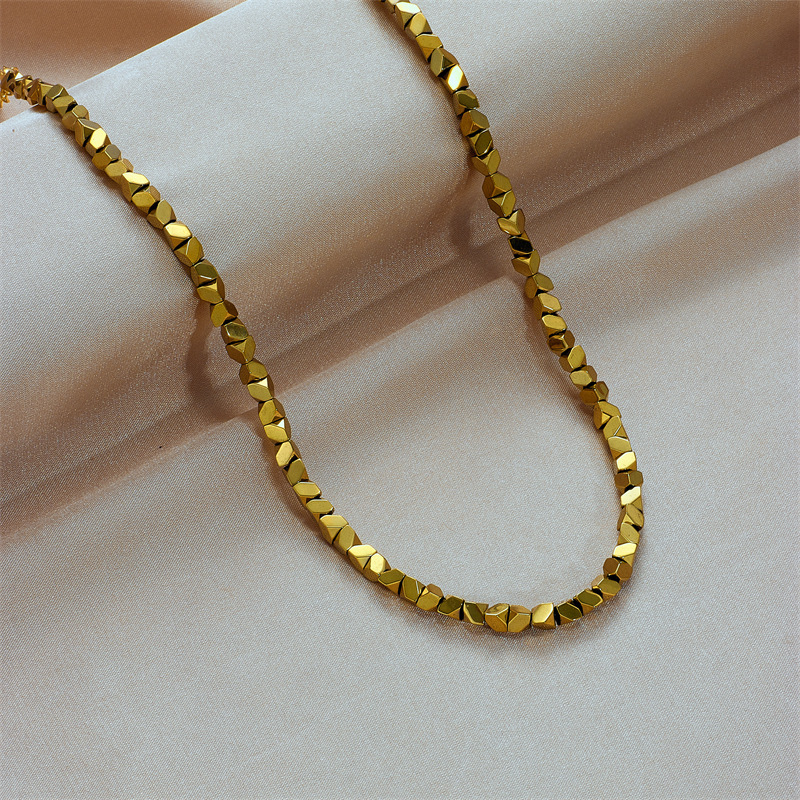 European and American cross-border niche design minimalist gold titanium steel faceted geometric beaded hand-woven chain necklace