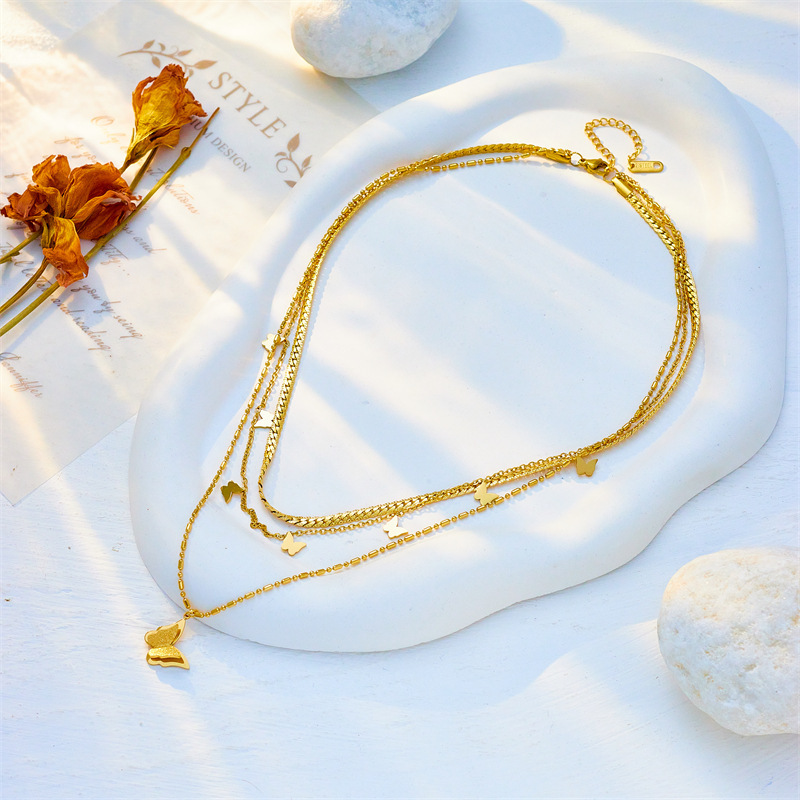 European and American style, light luxury, high-end, minimalist, niche design, multi-layered titanium steel stacked chain, smooth butterfly pendant necklace