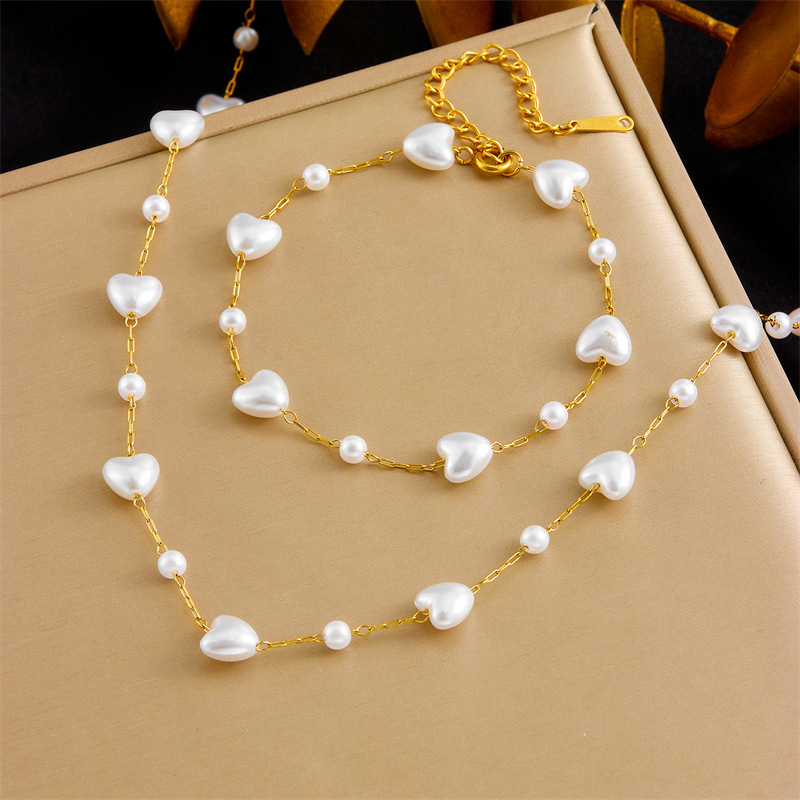 Cross-border fashion, elegant retro versatile pearl heart chain stainless steel accessory bracelet and necklace set