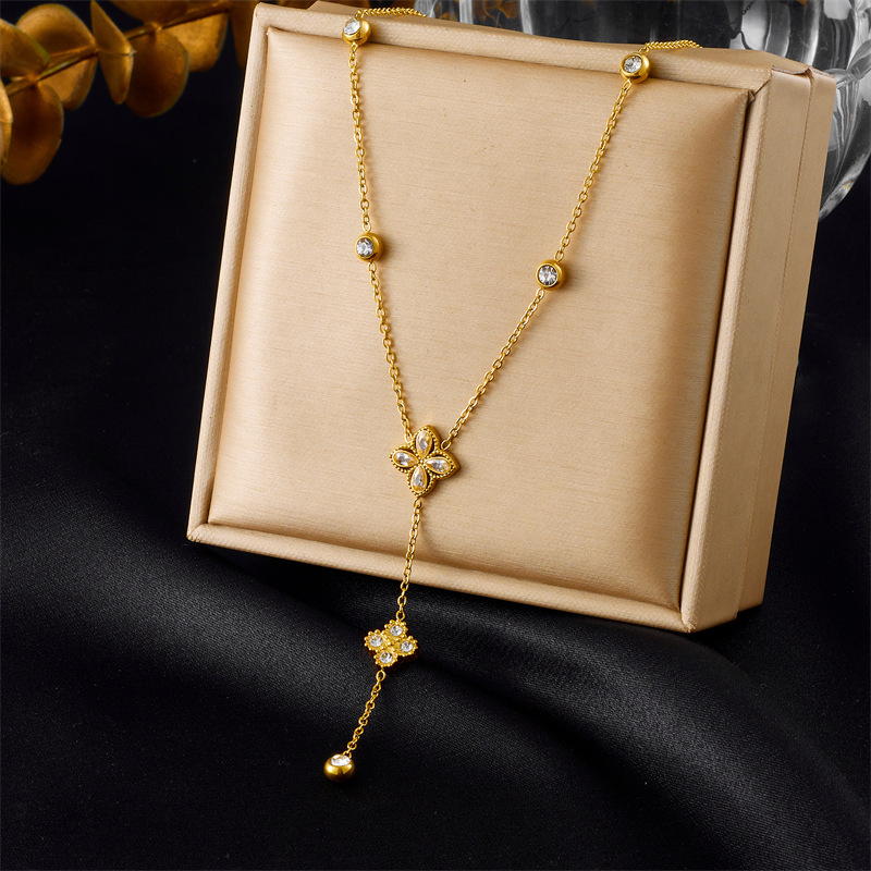 European and American cross-border fashion high-end diamond-encrusted four-petal flower tassel chain pendant stainless steel bracelet earring necklace set