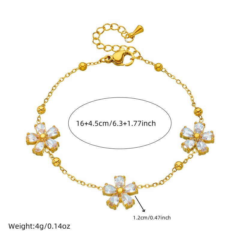 Stylish and simple yet elegant stainless steel jewelry set with transparent rhinestone flower accessories: necklace, earrings, and bracelet (three pieces)