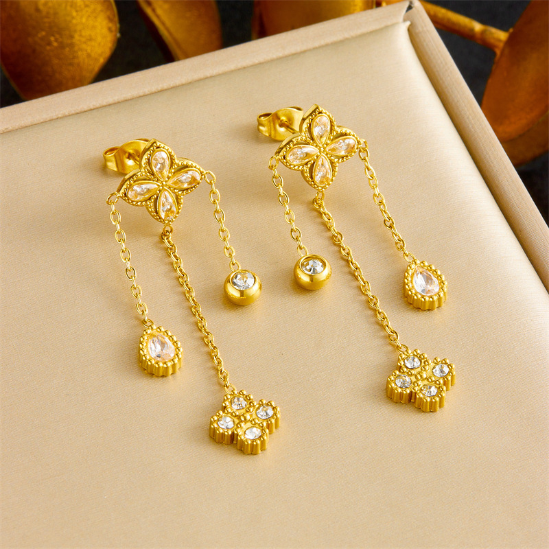 European and American cross-border fashion high-end diamond-encrusted four-petal flower tassel chain pendant stainless steel bracelet earring necklace set