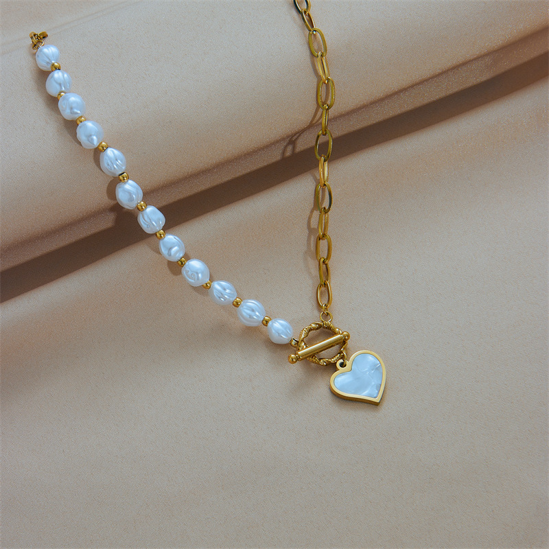 European and American fashion niche design titanium steel pearl chain asymmetrical splicing OT buckle clavicle chain heart pendant necklace