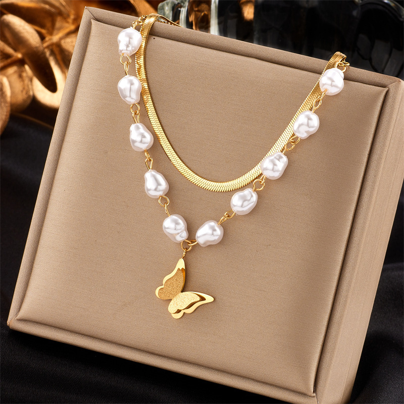 Fashionable, niche, creative design, retro ethnic style, pearl butterfly heart, rhinestone flower, eight-pointed star pendant necklace