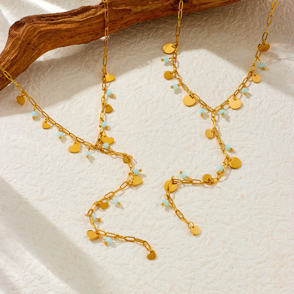 New, unique, versatile, and simple stainless steel necklace with rhinestone-studded heart-shaped accessories and Y-shaped long tassel.