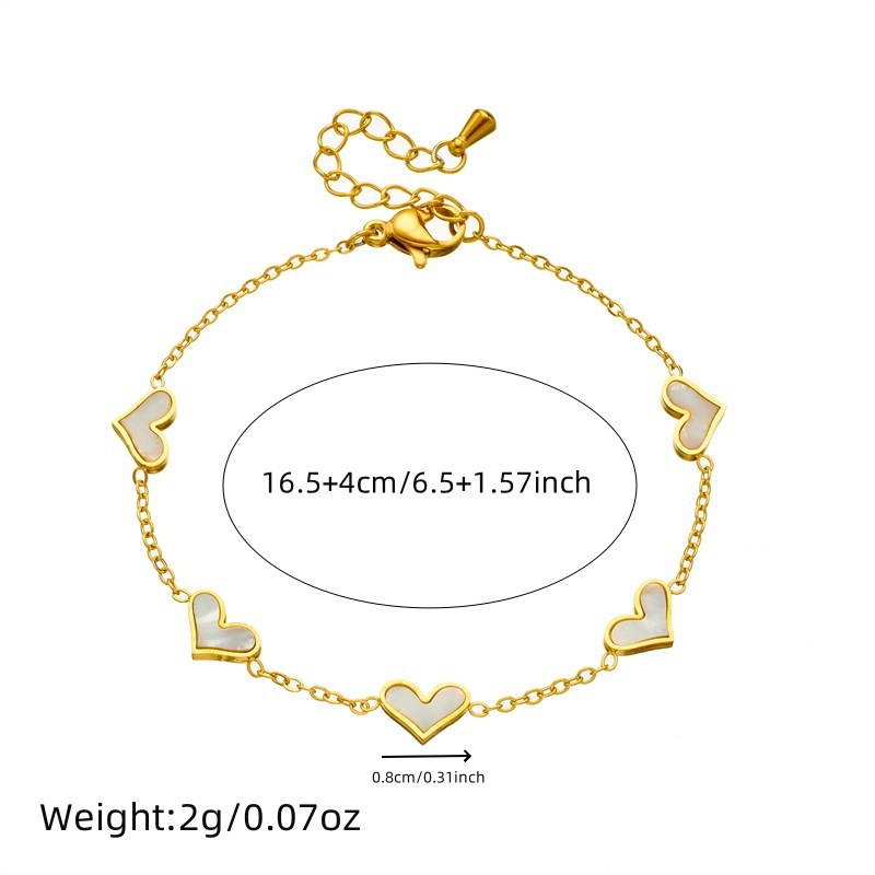 Korean style, simple and fashionable, elegant gold-plated seashell heart accessory chain stainless steel bracelet, earrings, and necklace set.