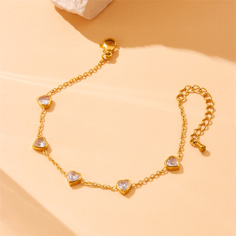 European and American cross-border fashion niche transparent heart accessories gold-plated stainless steel chain bracelet earring necklace set