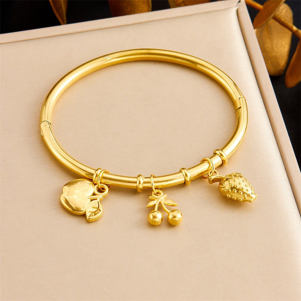 Niche fashion gold-plated stainless steel premium ocean-themed accessories: tropical fish, starfish, butterfly, conch, bamboo bracelet.