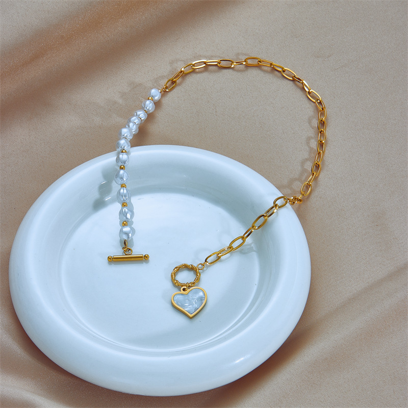 European and American fashion niche design titanium steel pearl chain asymmetrical splicing OT buckle clavicle chain heart pendant necklace