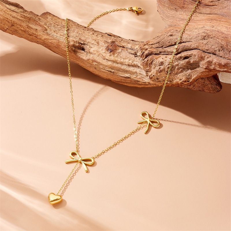Fashionable, cross-border, niche, minimalist gold-plated stainless steel long tassel chain bow pendant necklace