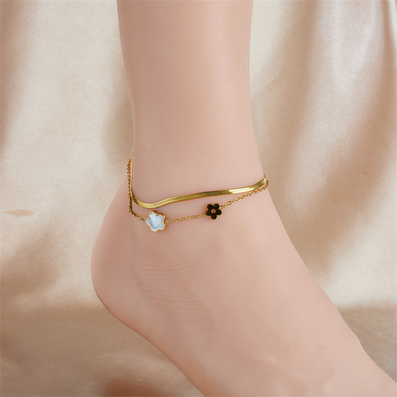 Stylish, niche, minimalist, elegant white seashell, butterfly, and flower accessory chain; multi-layered stainless steel anklet.