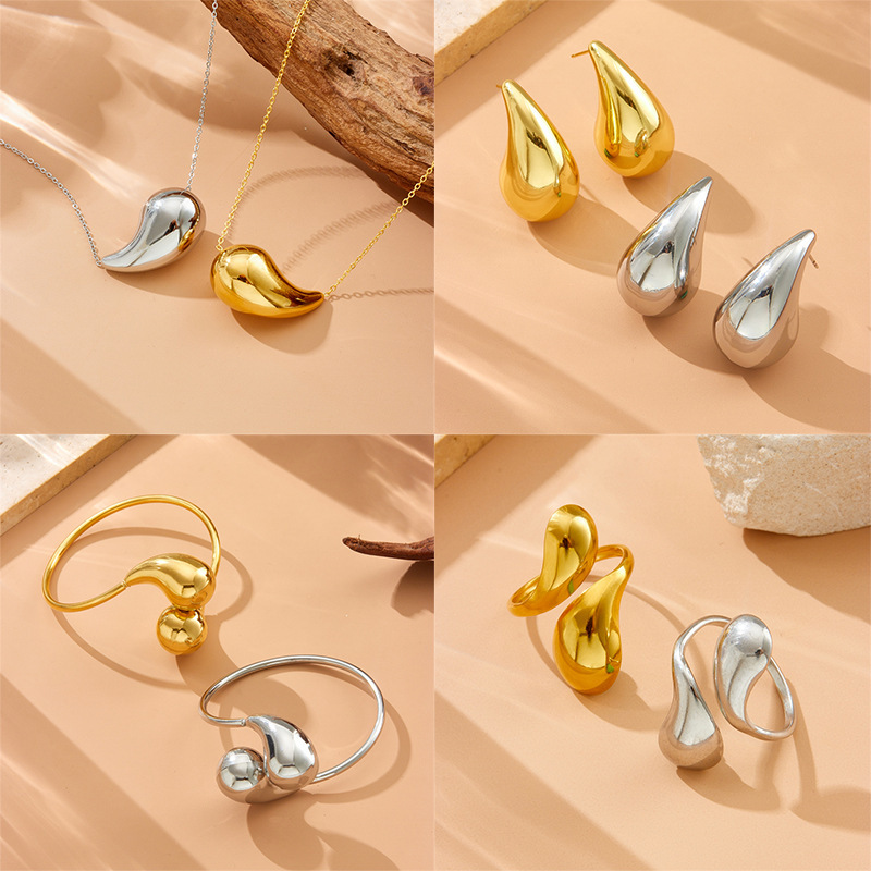Bestselling European and American style stainless steel hollow smooth teardrop bracelet, stainless steel material, gold and silver comma-shaped open set